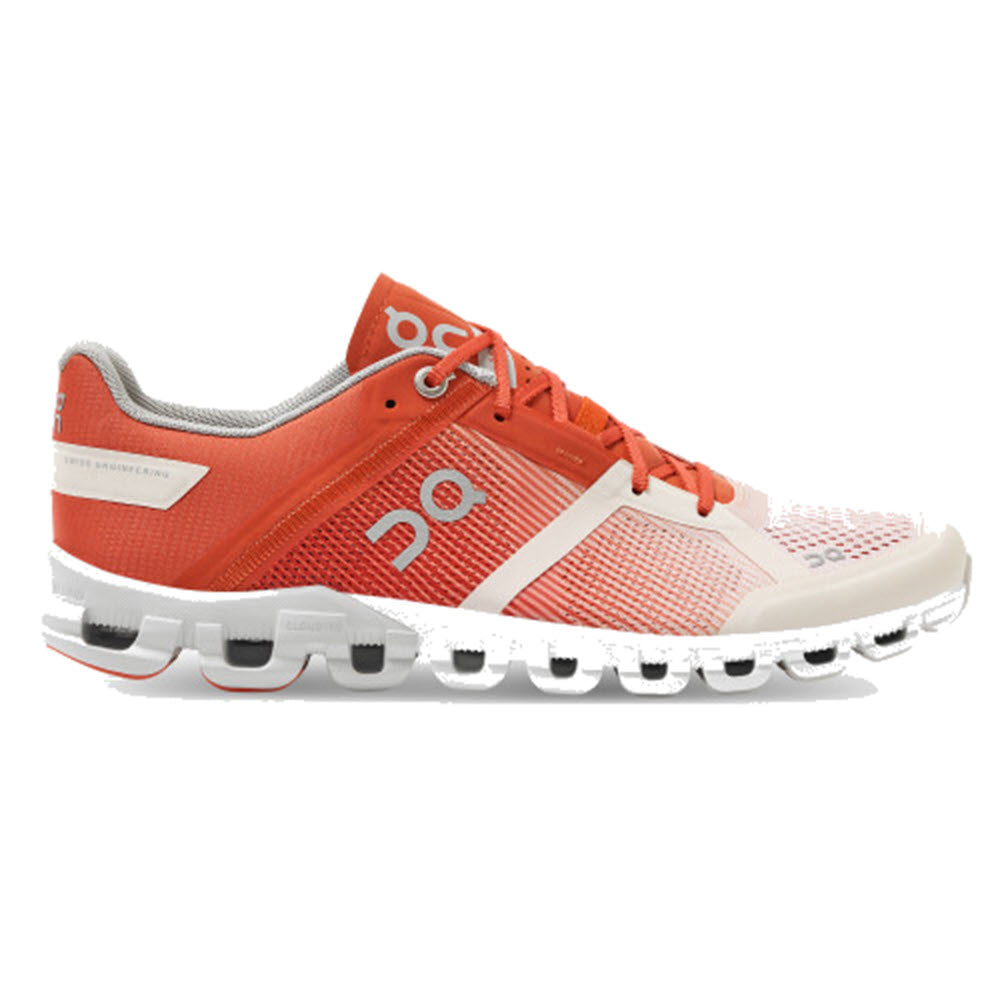 Orange and white On Running Cloudflow running shoe with unique sole design.