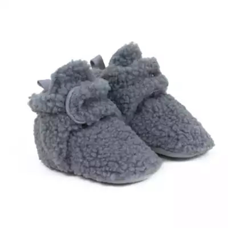 A pair of cozy, gray Robeez snap booties. 
Product Name: ROBEEZ SNAP BOOTIES GREY SHERPA - TODDLERS 
Brand Name: Robeez