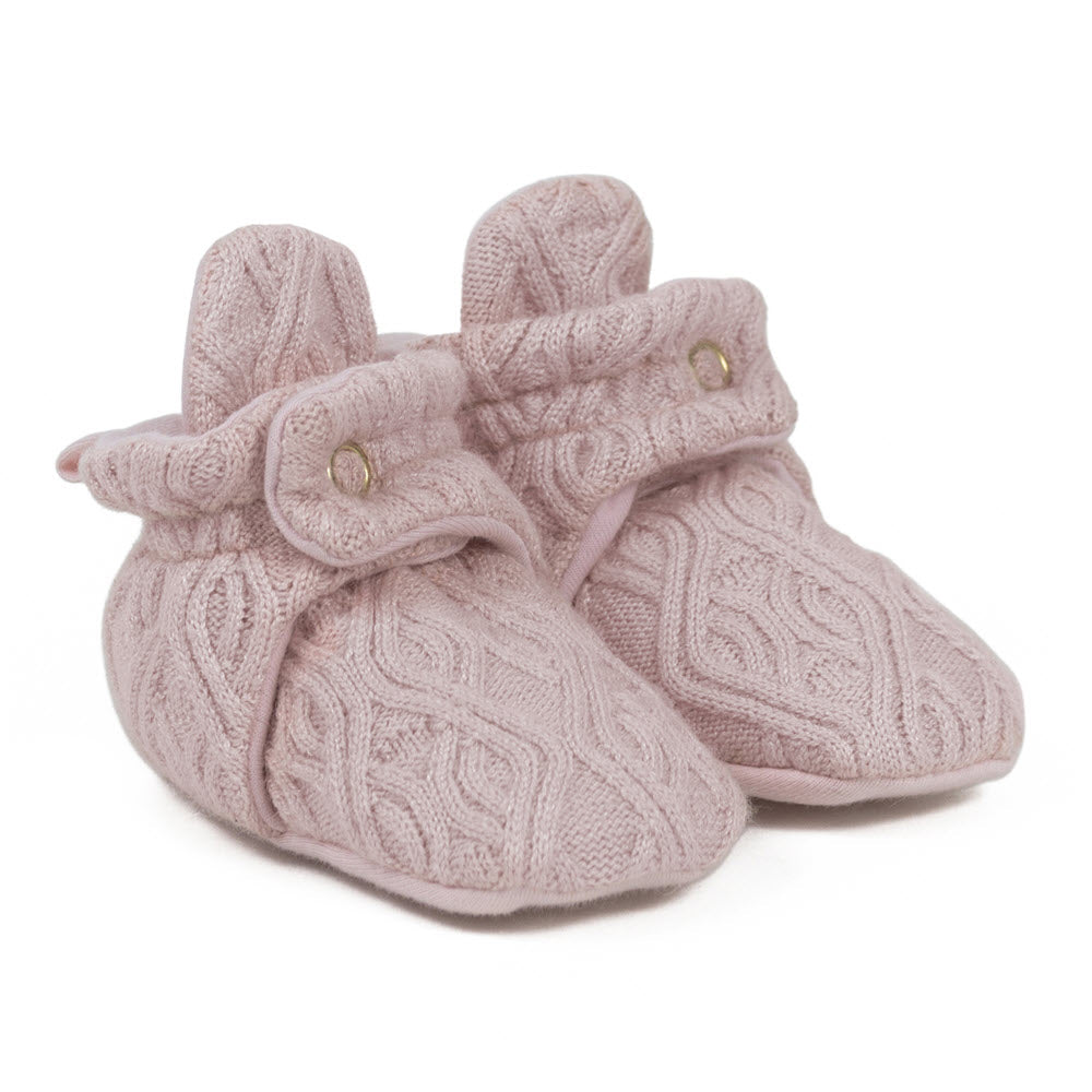 Pair of ROBEEZ Light Pink Sweater Knit Snap Booties on a white background, designed for baby feet warmth.