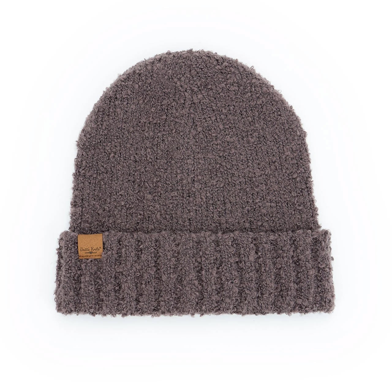 Brown Britts Knits Common Good Beanie Hat Berry with a vegan suede patch on a white background.