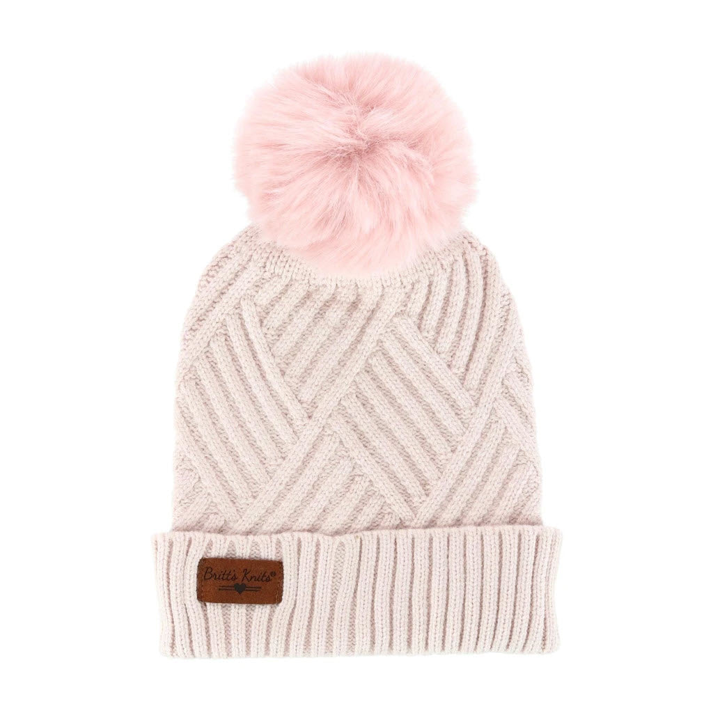 Sentence with replaced product:
Knitted beanie featuring a diamond-weave design, with a pink pompom and a Britts Knits label.