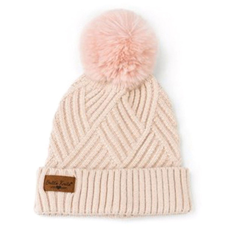 Britts Knits kids poof pom beanie with a pink poof pom and a leather logo tag.