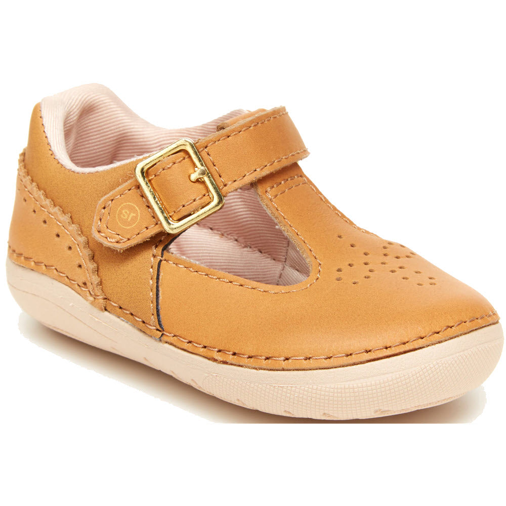 A single Stride Rite children&#39;s leather shoe with a buckle closure and decorative perforations.