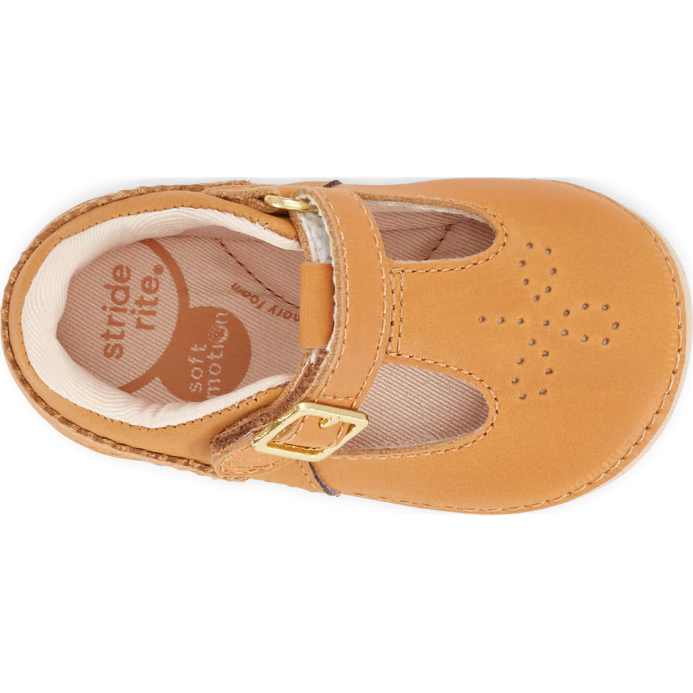 A single Stride Rite Soft Motion Lucianne Honey Tan toddler&#39;s Mary Jane shoe with a buckle fastening and perforated details.