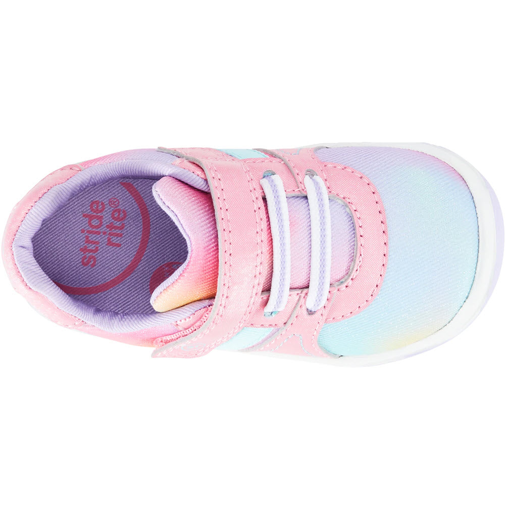 A single pastel-colored Stride Rite Thompson Tropical Pink Sneaker for children with velcro straps.