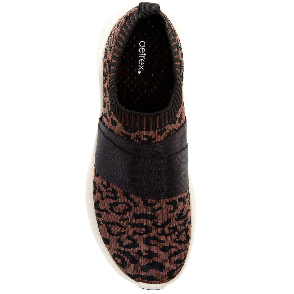 A single Aetrex Allie Leopard - Womens shoe featuring a camouflage print design and slip-on style, designed for plantar fasciitis relief with Lynco® Arch Support, isolated on a white background.
