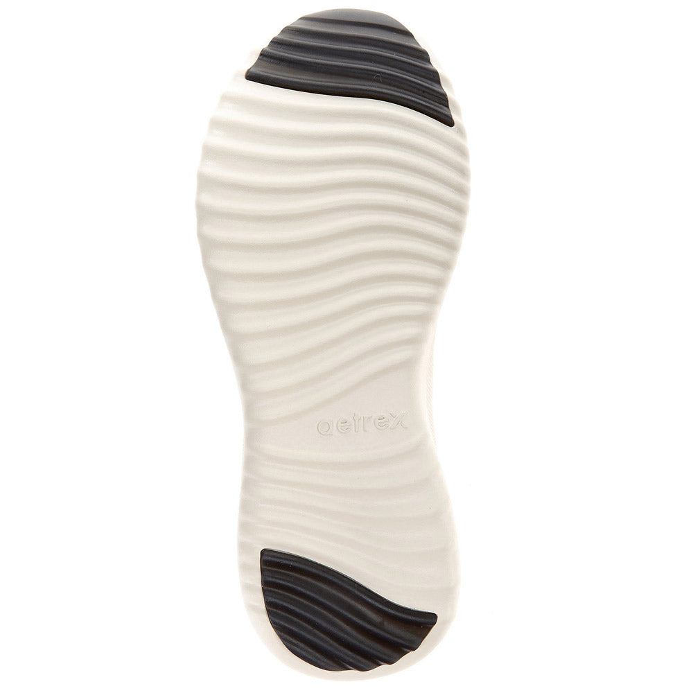 Tread pattern of a Aetrex® Allie Leopard - Womens shoe sole with a Lynco® Arch Support imprint.