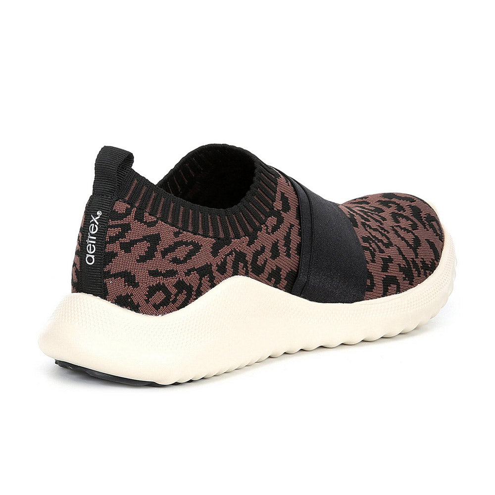 Sentence with replaced product name: Aetrex AETREX ALLIE LEOPARD - WOMENS women’s shoe with plantar fasciitis relief and a white sole.