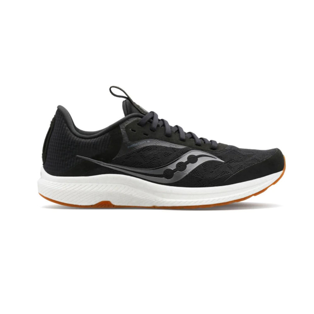 Black and white Saucony Freedom 5 Women&#39;s vegan running shoe with a distinctive wave-patterned midsole and orange accents on a white background.