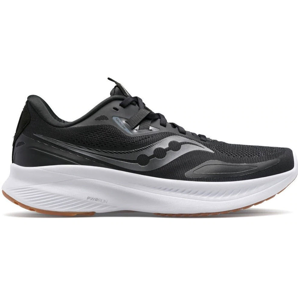 A Saucony Guide 15 black and gum running shoe with a prominent sole and lace-up front, designed for total comfort during your running experience.
