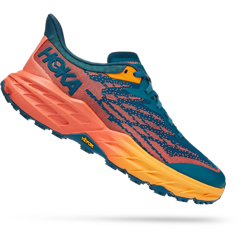 A vibrant blue and orange Hoka One One Speedgoat 5 trail running shoe with thick cushioning and a Vibram® Megagrip sole.