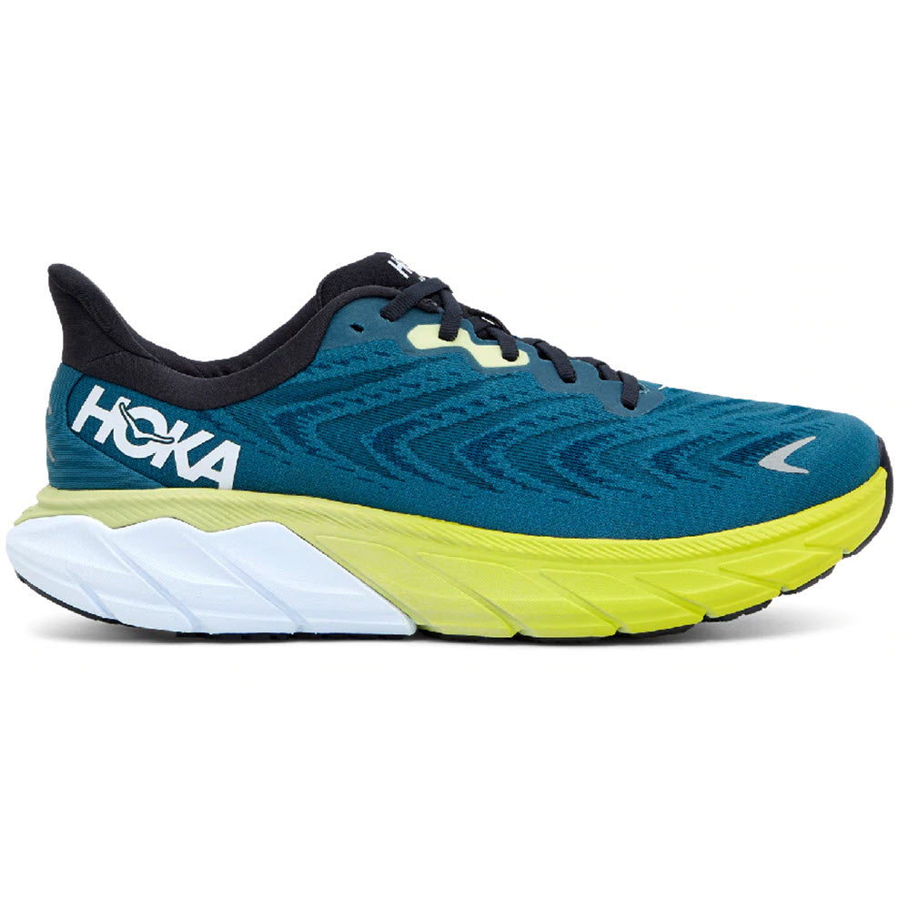 A blue and yellow HOKA ONE ONE ARAHI running shoe with maximal cushioning and an oversized sole.