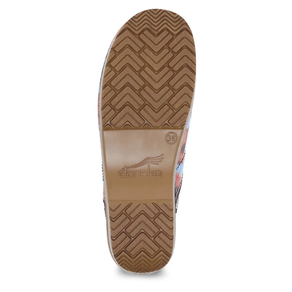 Sole of a Dansko shoe with a herringbone tread pattern and a branded inlay, designed for all-day comfort and support.