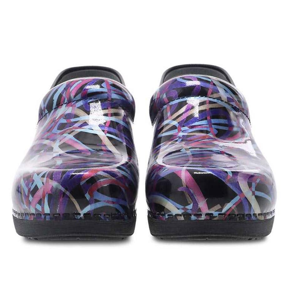 A pair of Dansko Pro XP 2.0 Ribbon Patent shoes with a colorful abstract design displayed from the rear view, featuring a slip-resistant rubber outsole.