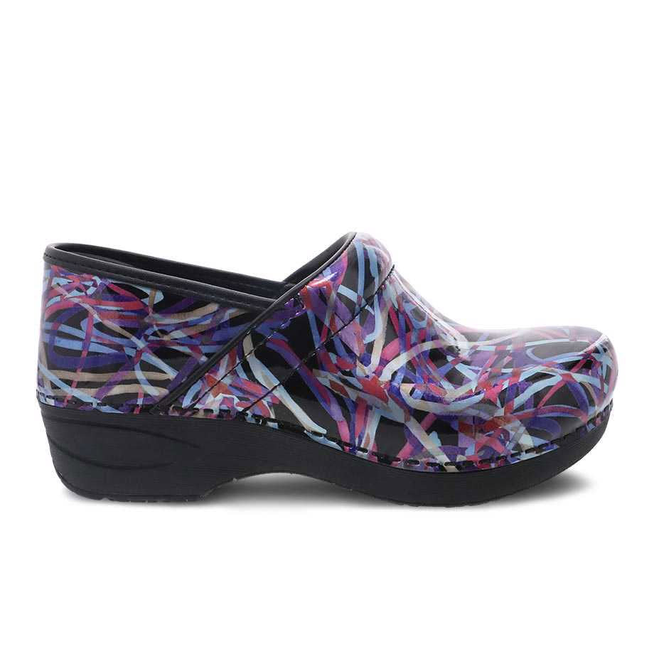 A single Dansko clog with a colorful abstract design and a slip-resistant rubber outsole on a white background.