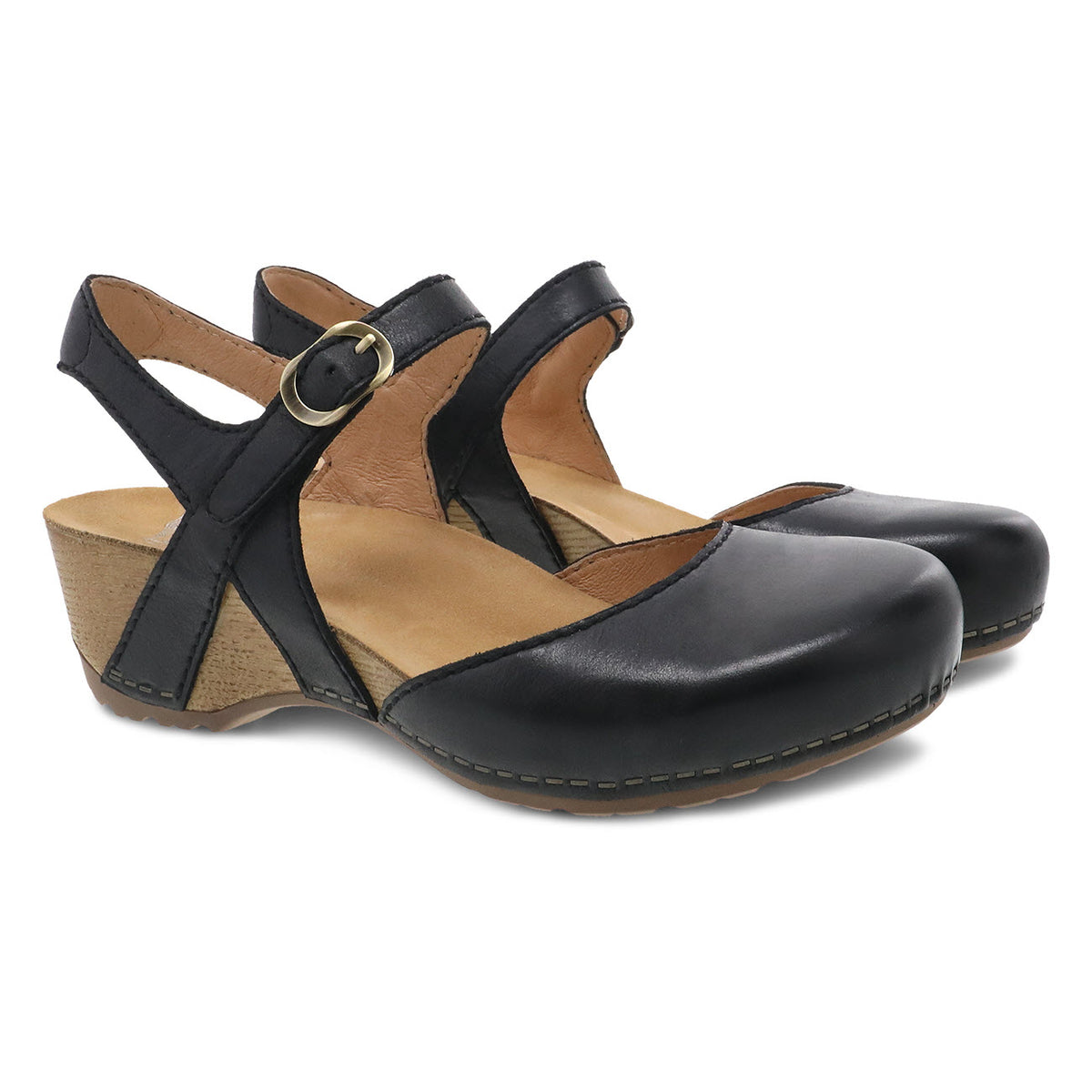 A pair of Dansko Tiffani black milled leather uppers sandals with a chunky heel and buckle strap.