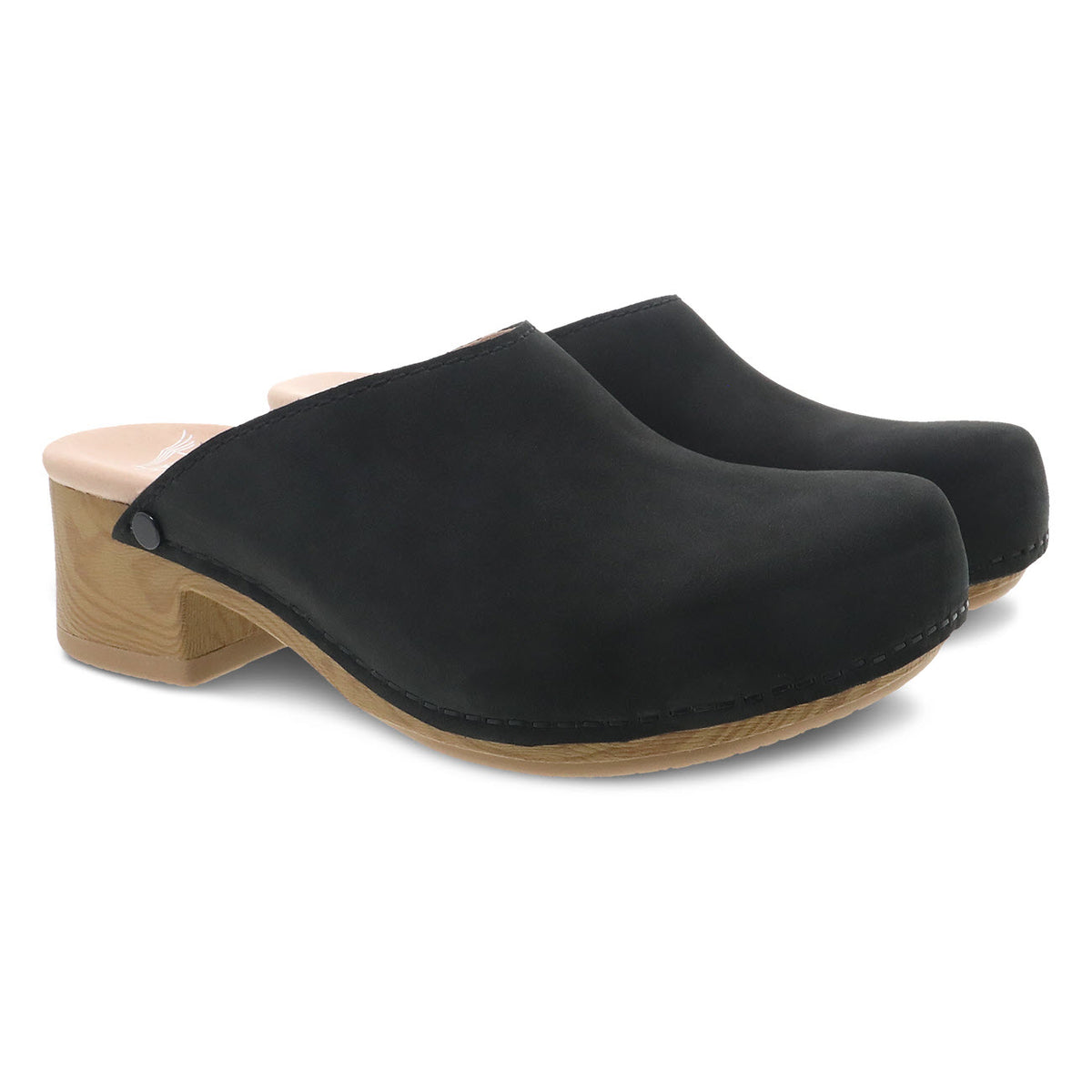 A pair of black Dansko Giulia clogs with wooden soles and a lightweight polypropylene midsole on a white background.