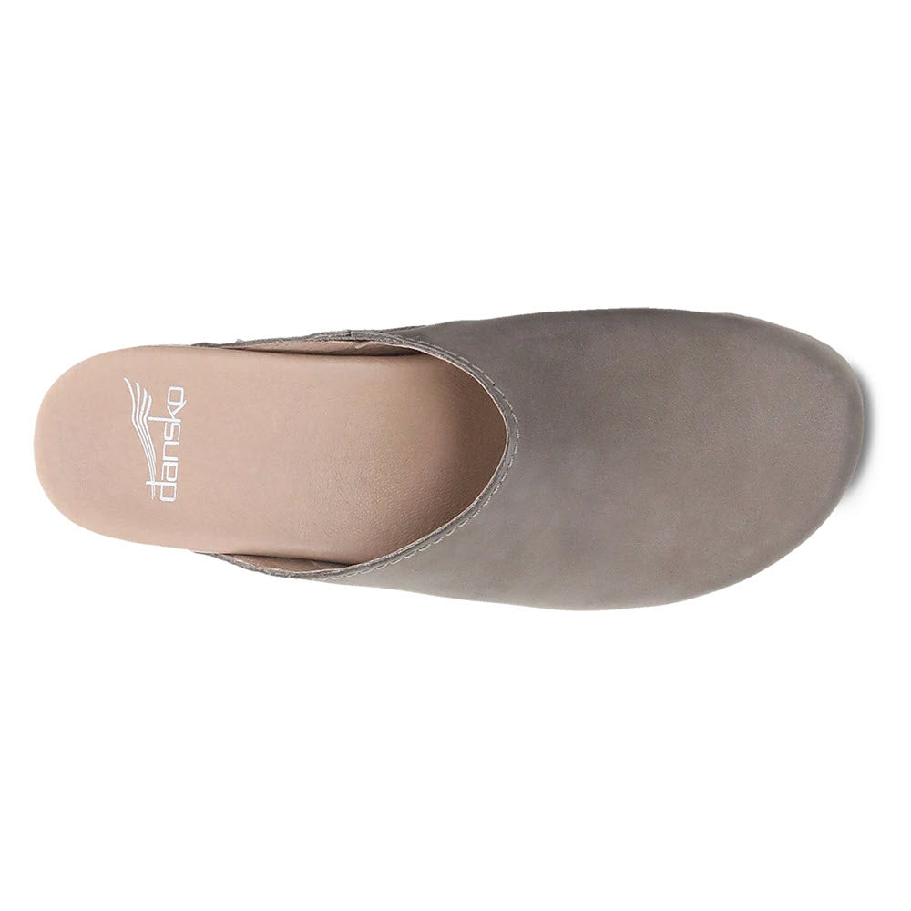 Top view of a single grey Dansko Giulia Milled Nubuck Taupe slip-on shoe with a white sole.