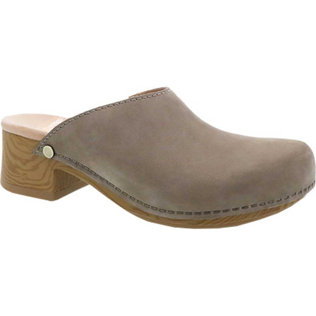 A single beige Dansko Giulia Milled Nubuck Taupe clog with a wooden heel on a white background.
