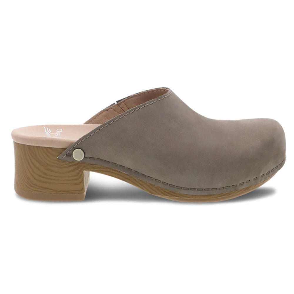 A single taupe Dansko Giulia Milled Nubuck clog with a wooden heel and decorative stitching on a white background.