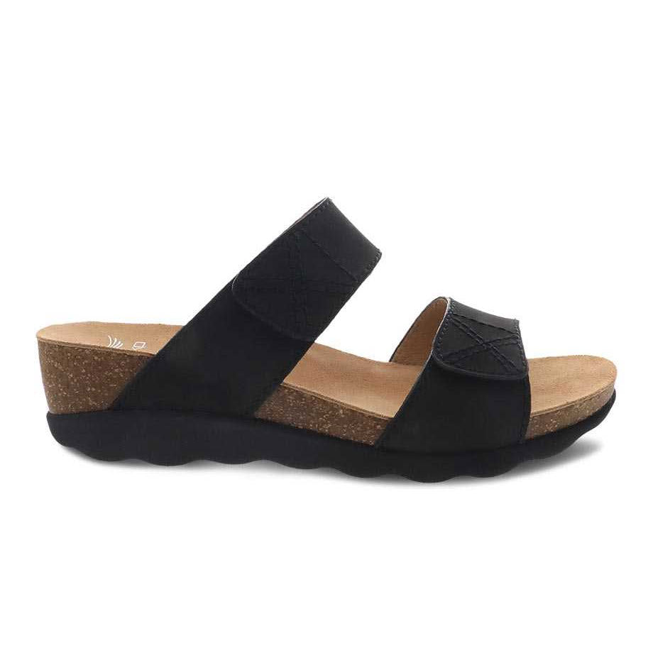 Dansko black women&#39;s Maddy slide platform sandal with cork footbed and rubber sole.