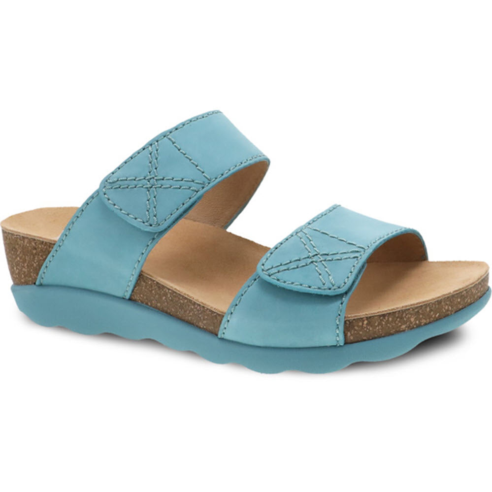 Blue casual women&#39;s Dansko Maddy Lagoon Milled Nubuck slide with cork footbed and contrast stitching.