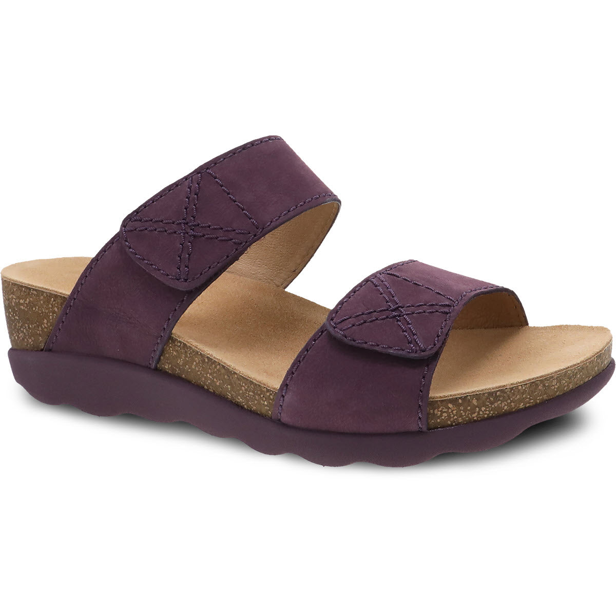 A pair of Dansko Maddy Purple Nubuck Women&#39;s wedge sandals with double velcro straps on a white background.