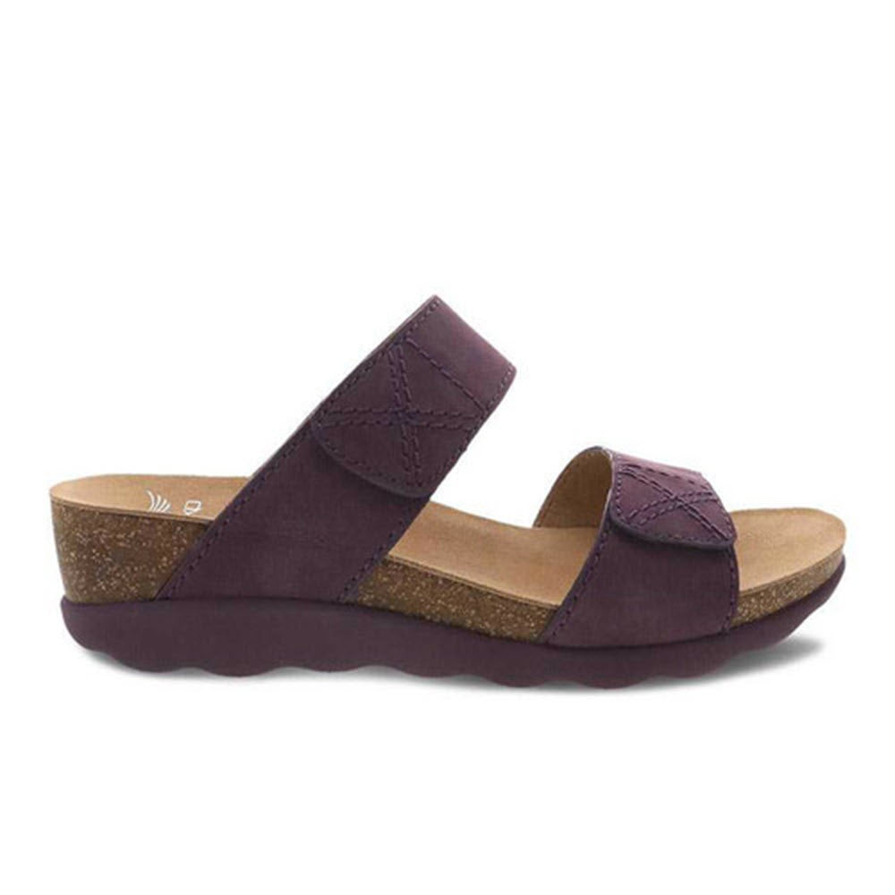 A single DANSKO MADDY PURPLE NUBUCK wedge sandal with an adjustable strap and a lightweight cork midsole against a white background.