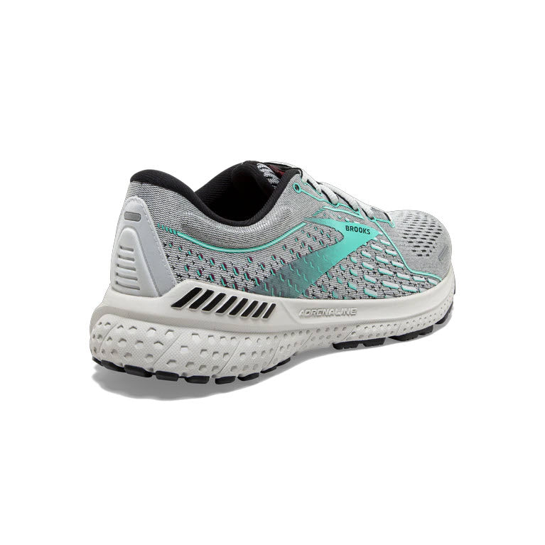 A single teal and white Brooks Adrenaline GTS 21 road-running shoe displayed against a white background.