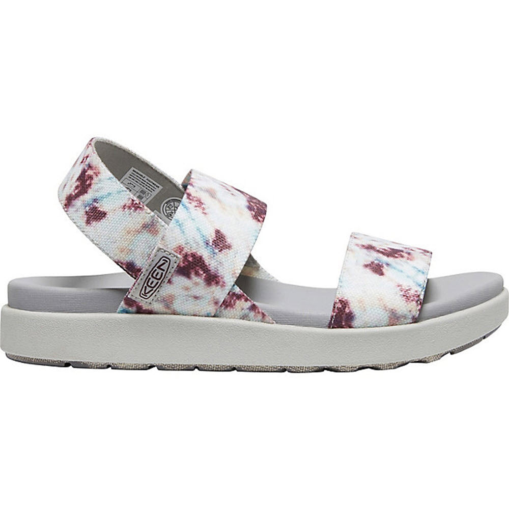 A sandal with a tie-dye pattern on white background, known as the KEEN ELLE BACKSTRAP ANDORRA TIE DYE - WOMENS by Keen.