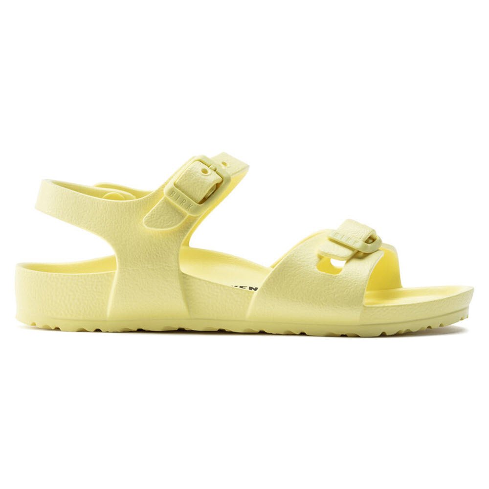 Yellow Birkenstock Rio platform sandals with adjustable straps.