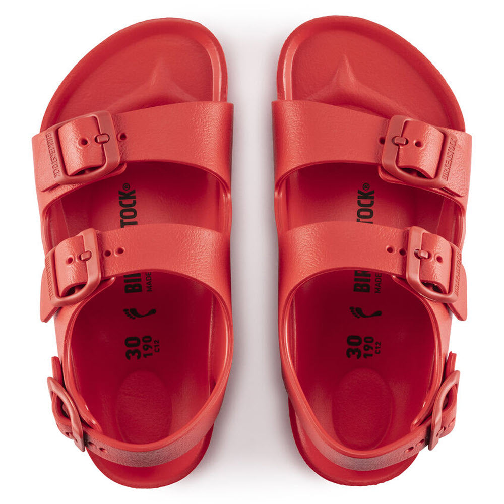 A pair of Birkenstock Milano Eva Active Red kids sandals with adjustable straps, viewed from above.