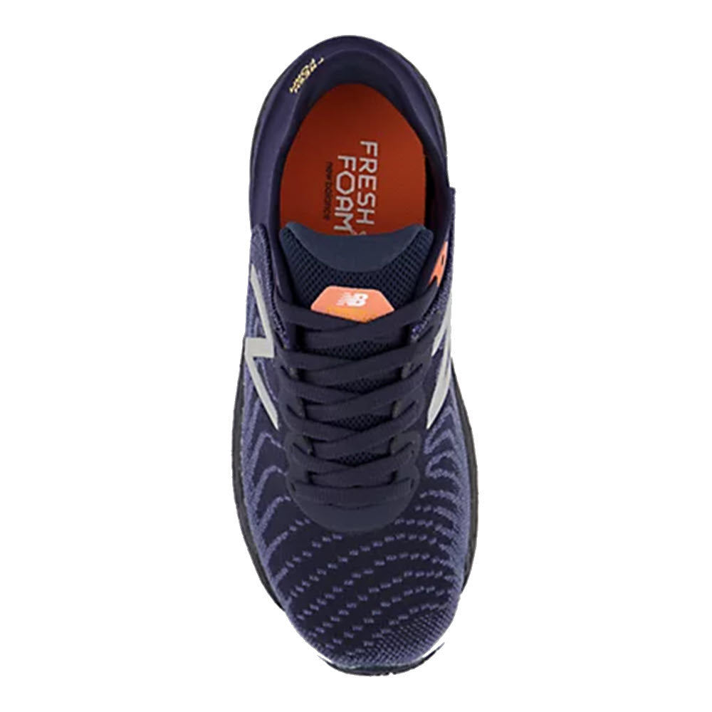 Top view of a single blue and orange New Balance Fresh Foam 860v11 Spring Tide - Kids&#39; running shoe with stability-minded runner &quot;fresh foam&quot; insole.