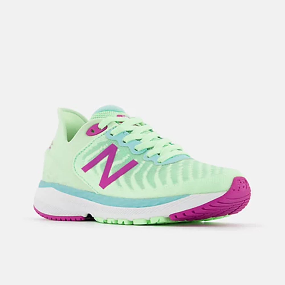 A vibrant New Balance Fresh Foam 860v11 Vibrant Spring Glo kids&#39; running shoe in pastel green with purple accents and a white sole.