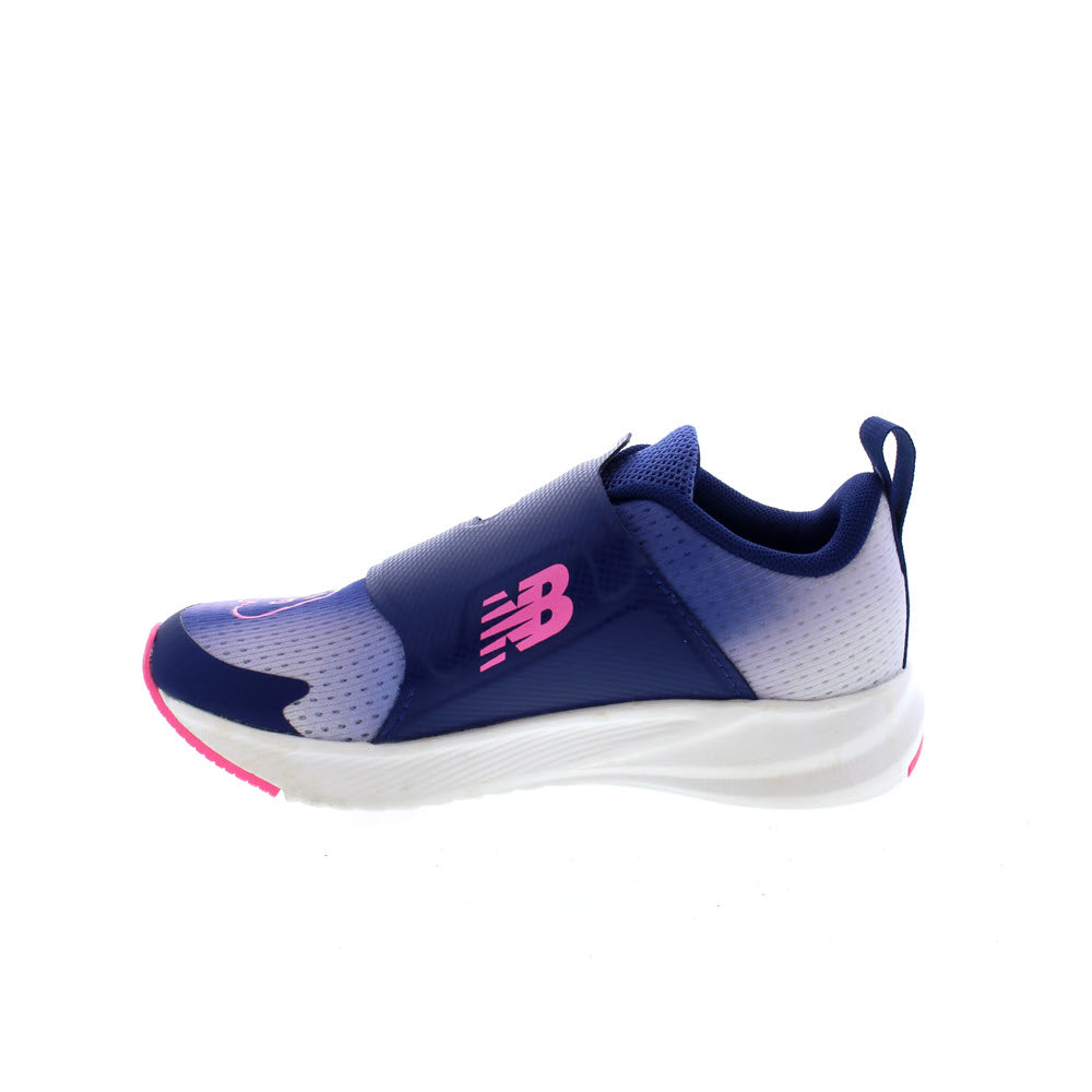 A single blue and pink New Balance FuelCore Reveal Boa Vibrant Violet kids&#39; running shoe displayed against a white background.