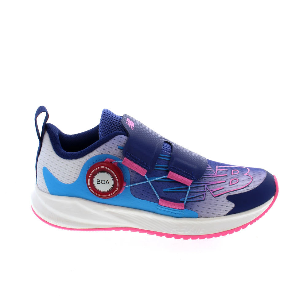 A child&#39;s New Balance FuelCore Reveal BOA Vibrant Violet athletic shoe with a combination of blue, pink, and white colors, featuring a BOA Performance Fit System.