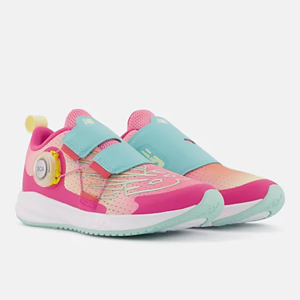A pair of colorful New Balance FuelCore Reveal BOA HI-PINK/SURF - KIDS kids&#39; running shoes with a hook and loop closure.