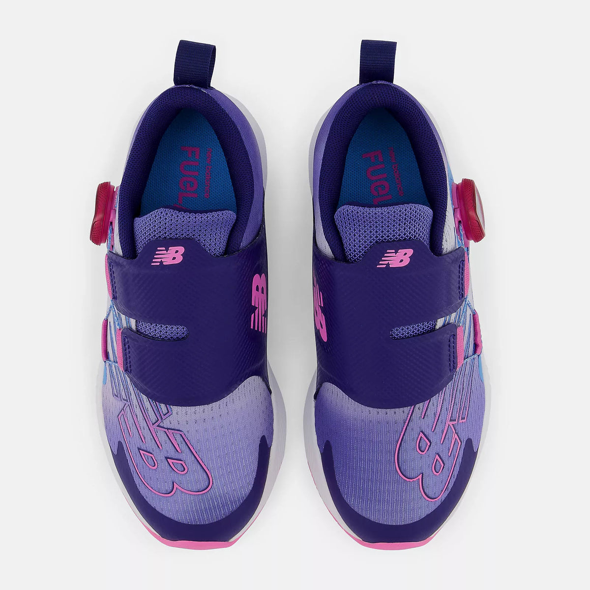 A pair of purple New Balance FuelCore Reveal Boa Vibrant Violet sneakers with Velcro straps, viewed from above.