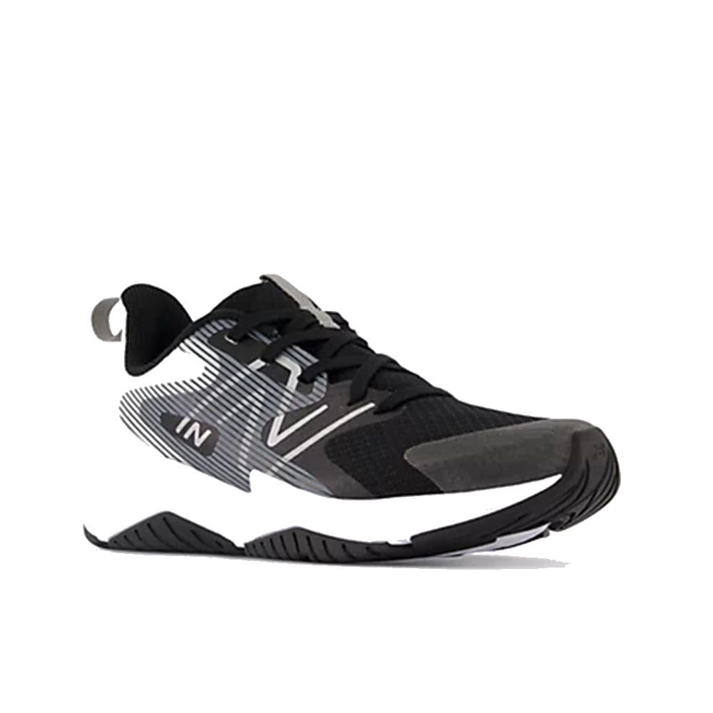 A single New Balance Rave Run V2 Black/White - Kids running shoe with a striped pattern and prominent brand logo displayed against a white background.