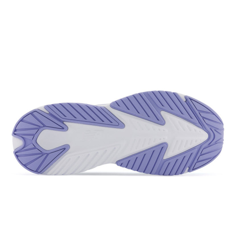 Sole of a New Balance Rave Run V2 Surf/Peach Glaze - Kids&#39; running shoe with purple and white tread pattern.