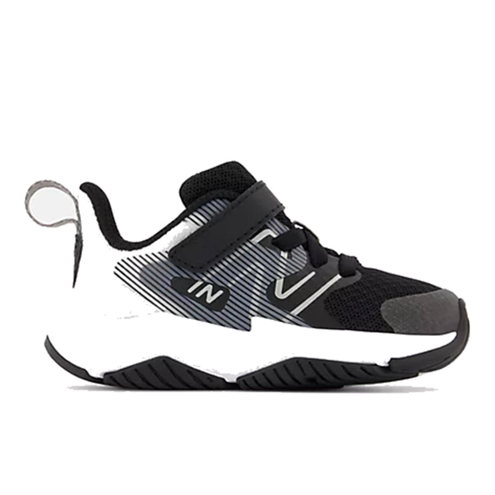 New Balance black and white kids’ running shoe with velcro strap, pull tab, and breathable mesh upper.