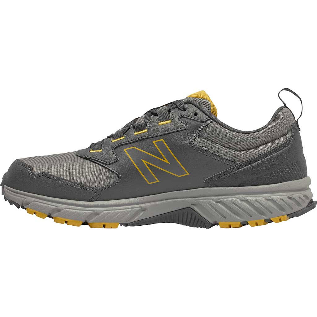 A grey New Balance 510v5 trail running shoe with a yellow logo and accents, featuring ABZORB technology.