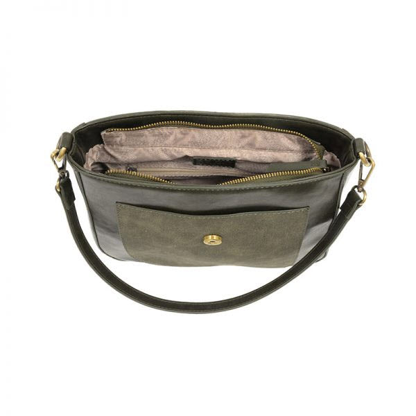 Open black vegan leather Joy Susan Lexie Convertible Flap Bag Olive with a front flap pocket on a white background.