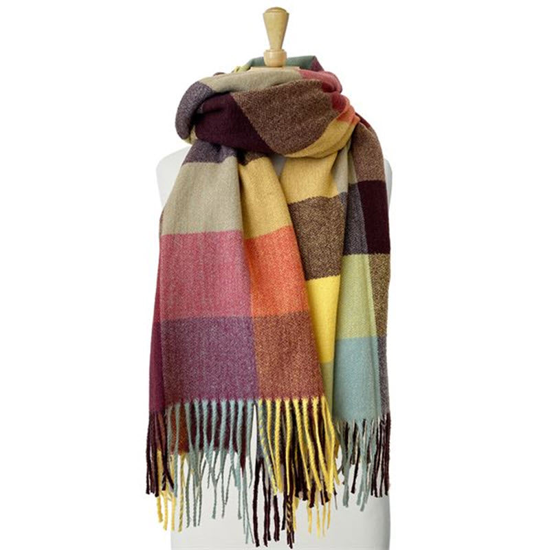 A CARACOL PLAID SCARF MULTI with fringe displayed on a mannequin.