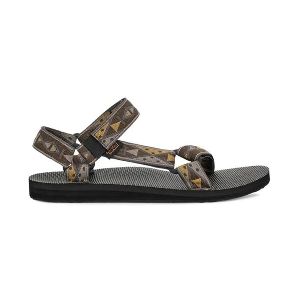 A single Teva sandal with a patterned strap design on a white background offers timeless comfort.