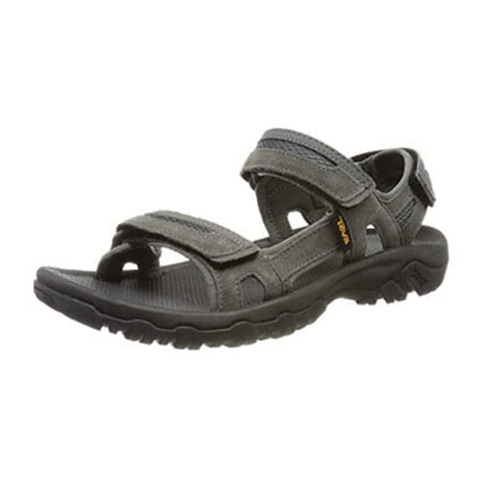 A single dark gull grey Teva Hudson Sandal with multiple hook &#39;n&#39; loop adjustable straps and a thick sole, isolated on a white background.