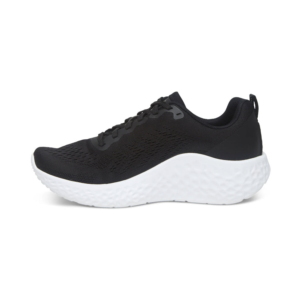 Aetrex Danika black supportive mesh running shoe isolated on a white background.