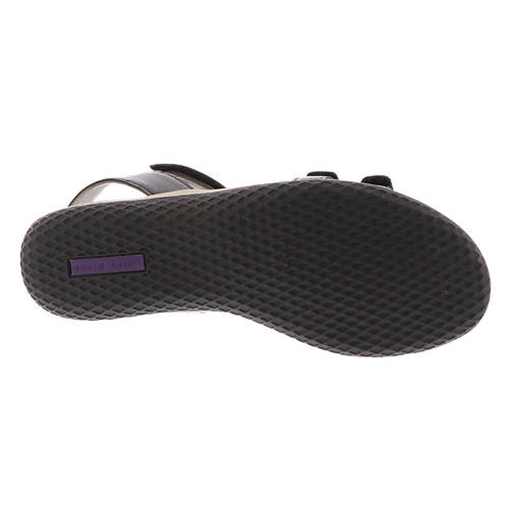 The sole of a David Tate Mate Black - Womens comfort-cushioned footbed wedge sandal with a textured pattern and a visible brand label.