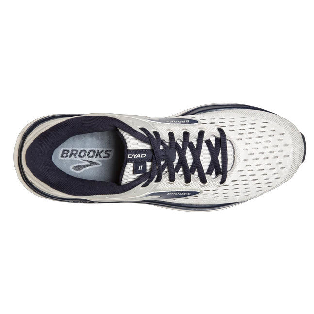 Top view of a single white and navy blue Brooks Dyad 11 Antarctica/Grey/Peacock running shoe with cushioned comfort.