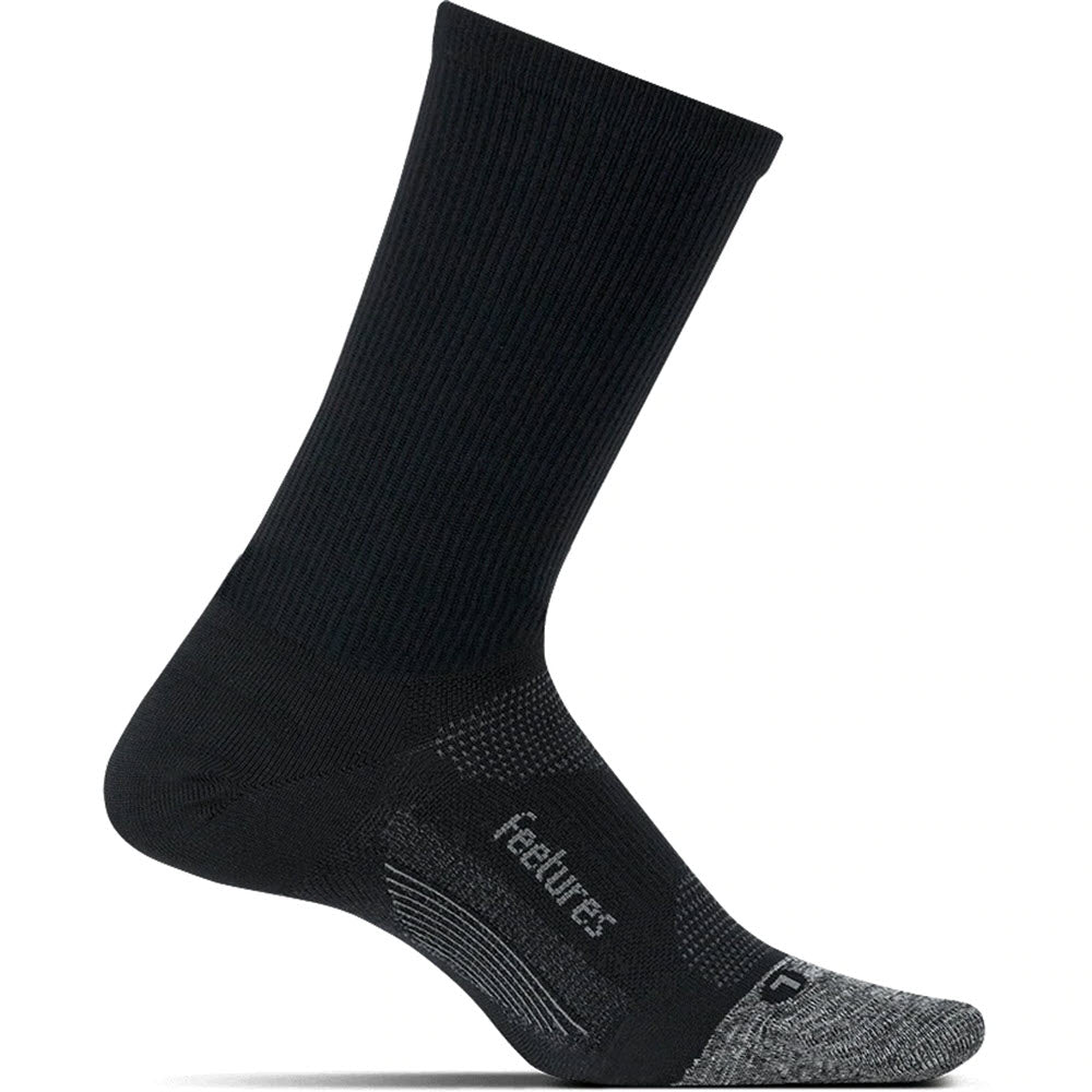 Black Feetures Elite Ultra Light Micro Crew sock with reinforced heel and toe area, featuring a brand logo.